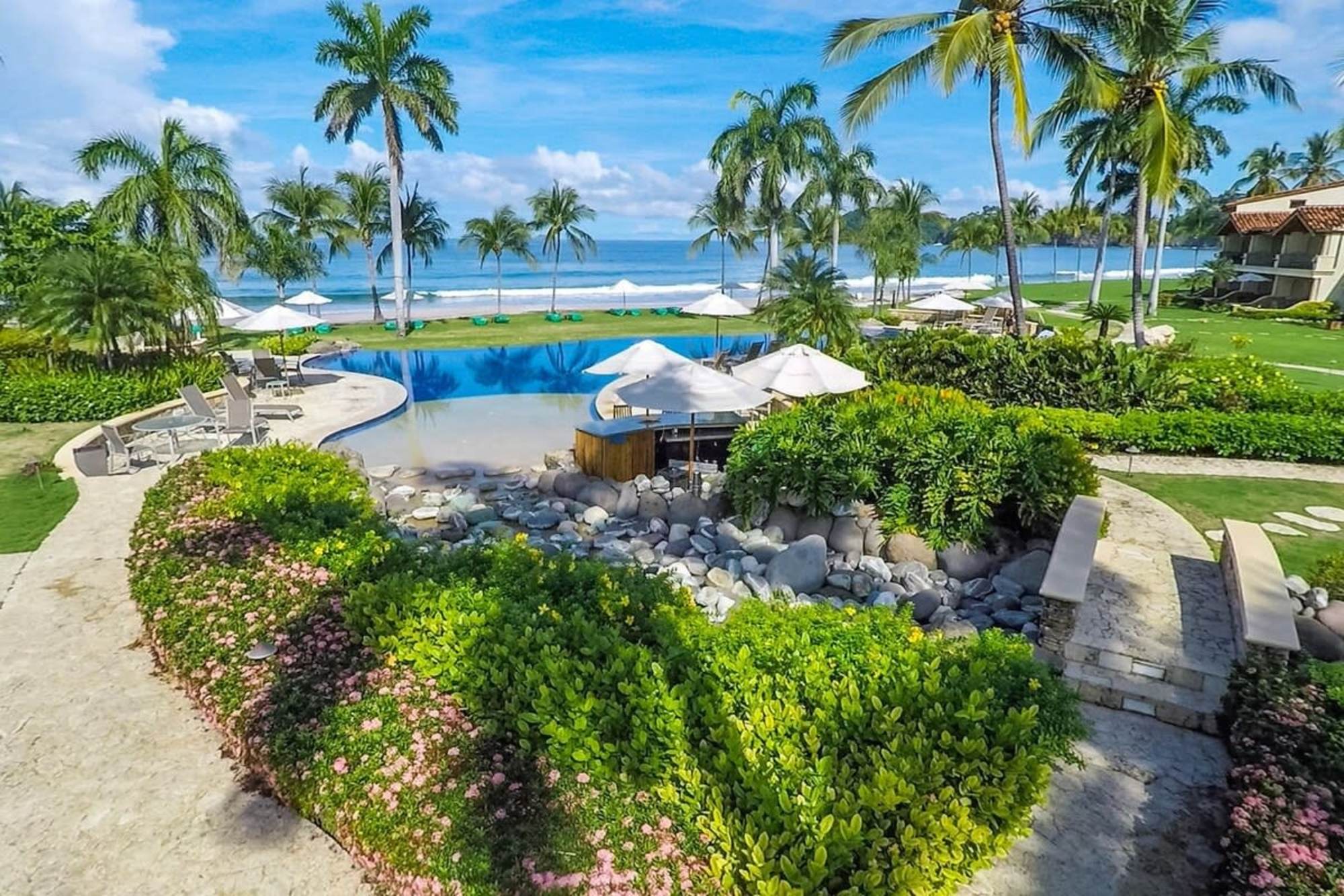 The Palms pool and beach at Playa Flamingo